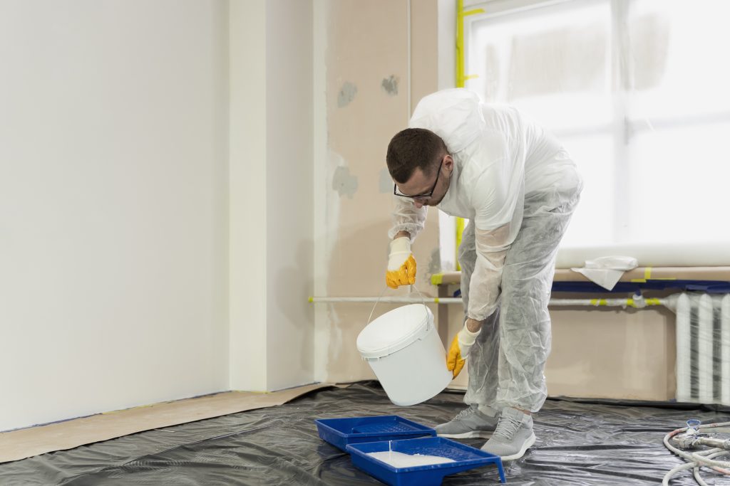 full-shot-man-pouring-paint full-shot-man-pouring-paint